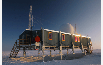 Sun dips to near the horizon and illuminates scientific station